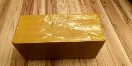 The Android screen as delivered, in a heavily taped cardboard box