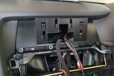 Mounting base fitted into the factory monitor opening