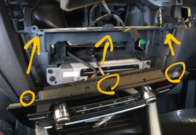 Torx screws securing the climate/audio control panel