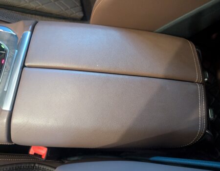 Stock armrest before installing the cover