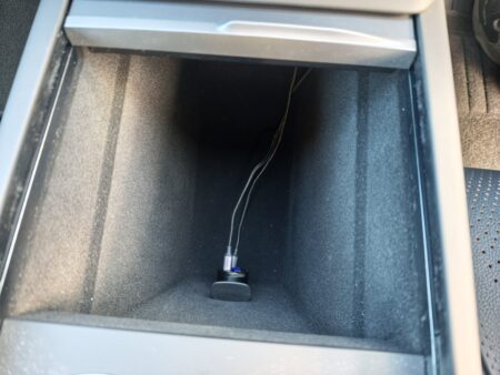 The front console in stock form, with a USB adapter in the 12V socket
