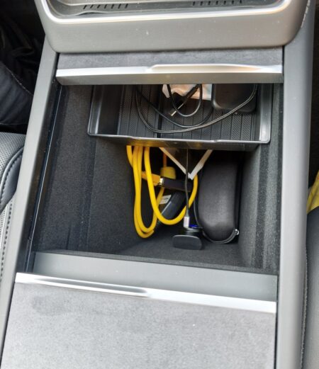 Sliding the front tray back to reach items on the lower level