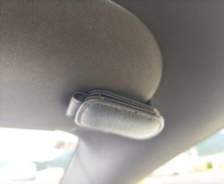 Model YL sunglasses holder mounted on the sun visor