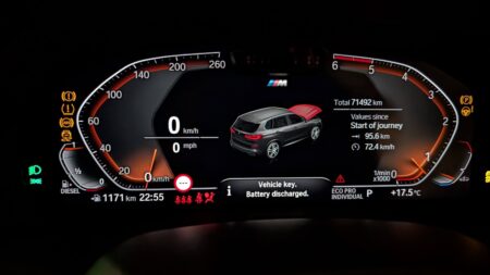 BMW G05 instrument cluster showing Vehicle key. Battery discharged.