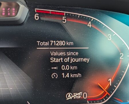 BMW X5 instrument cluster showing a total of 71,280 km
