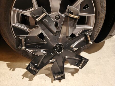 Back of a removed Model YL aero cover with clips around the rim