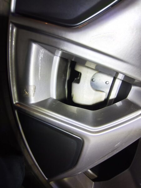 Model YL rear brake caliper visible between the wheel spokes