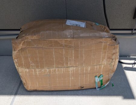 The AliExpress box the floor mats arrived in