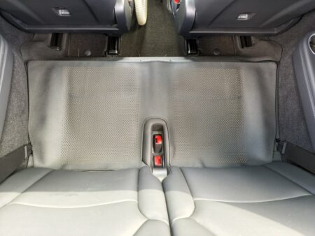 Bottom seat cover laid over the Model YL third row