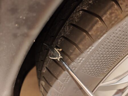Levering a stone out of the tread with the hooked tip