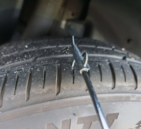 Close-up of the hooked tip slid into a tread groove