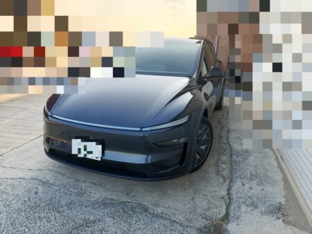 Model YL parked at the glass repair workshop, background blurred