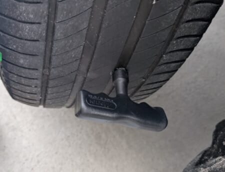 Pushing the reamer into the hole in the tread