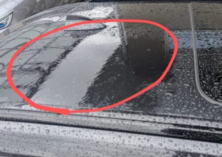 Rain sitting flat on the dull roof before polishing
