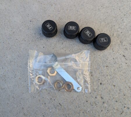 The four TPMS sensors, each marked with its wheel position